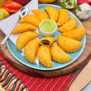 Mini vegan empanadas fille with black bean and vegetables