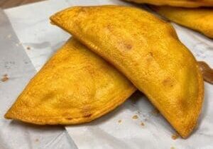 Crispy golden corn empanadas ready to serve - Illustrative Image